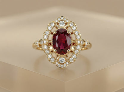 Ring i massivt gull med oval rubin